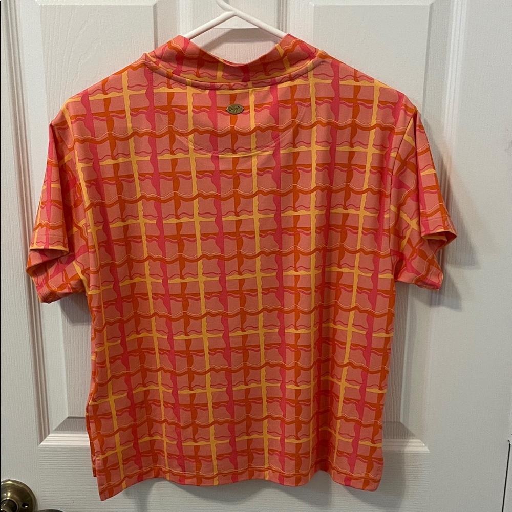 Puma Dani Dazey Woman’s Vibrant Red and Orange Checkered Golf Tee - Picture 3 of 4